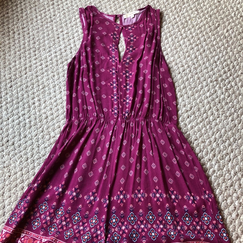 Rewind size medium romper; magenta pattern
